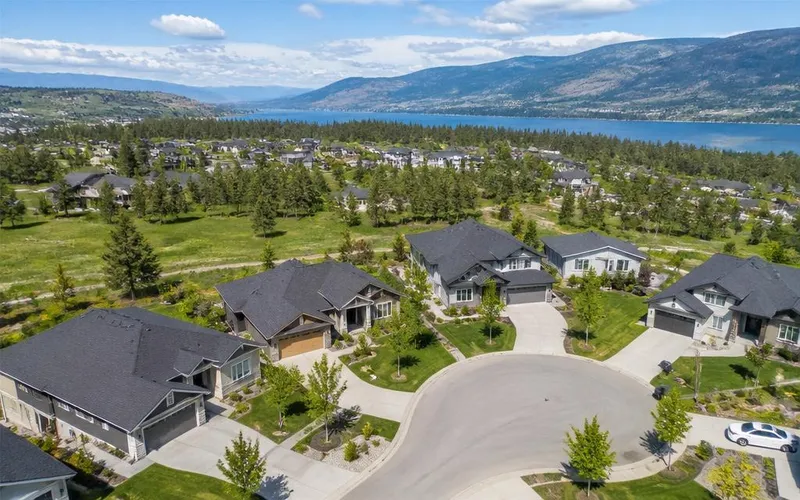 Aerial view of Middleton in Vernon, BC — spacious newer homes on large green lots near Okanagan Lake